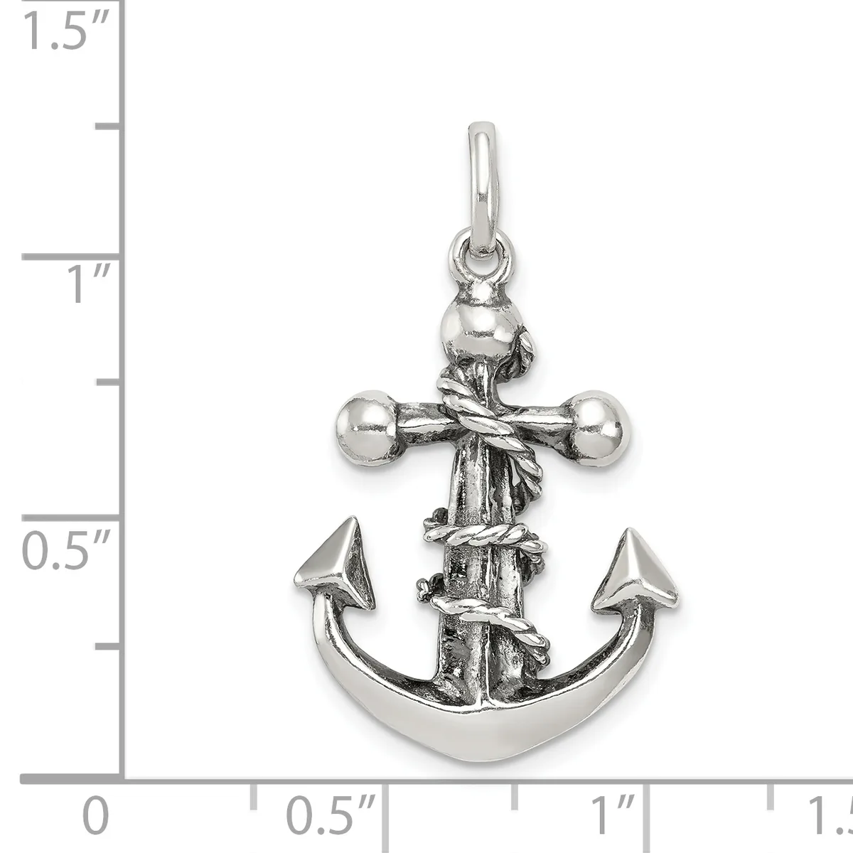 Silver anchor pendant with cross above it and rope wrapping, shown next to a ruler measuring approximately one inch in height.