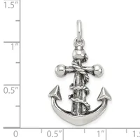 Silver anchor pendant with cross above it and rope wrapping, shown next to a ruler measuring approximately one inch in height.