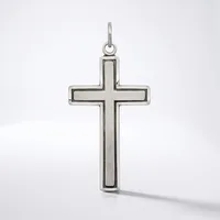 A silver cross pendant with a hollow rectangular center and rounded edges, suspended from a loop at the top, displayed against a white background.