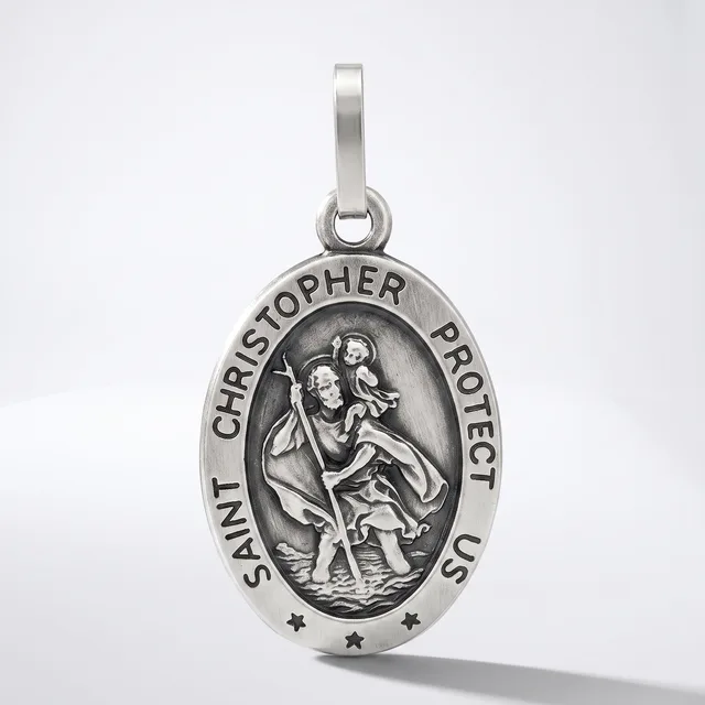 A silver oval pendant featuring Saint Christopher carrying a child, with text around the border and small stars at the bottom, suspended from a silver bail.