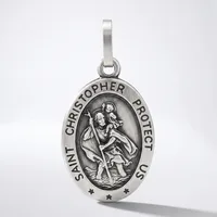 A silver oval pendant featuring Saint Christopher carrying a child, with text around the border and small stars at the bottom, suspended from a silver bail.