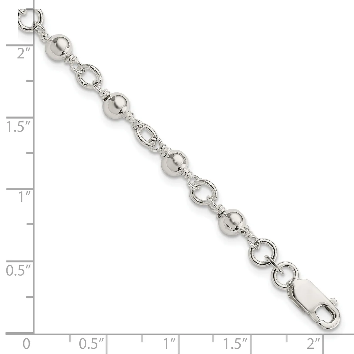 Silver-tone bracelet with alternating round ball beads and open circular link elements, displayed against a ruler showing approximately two inches in length.
