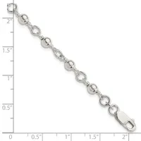 Silver-tone bracelet with alternating round ball beads and open circular link elements, displayed against a ruler showing approximately two inches in length.