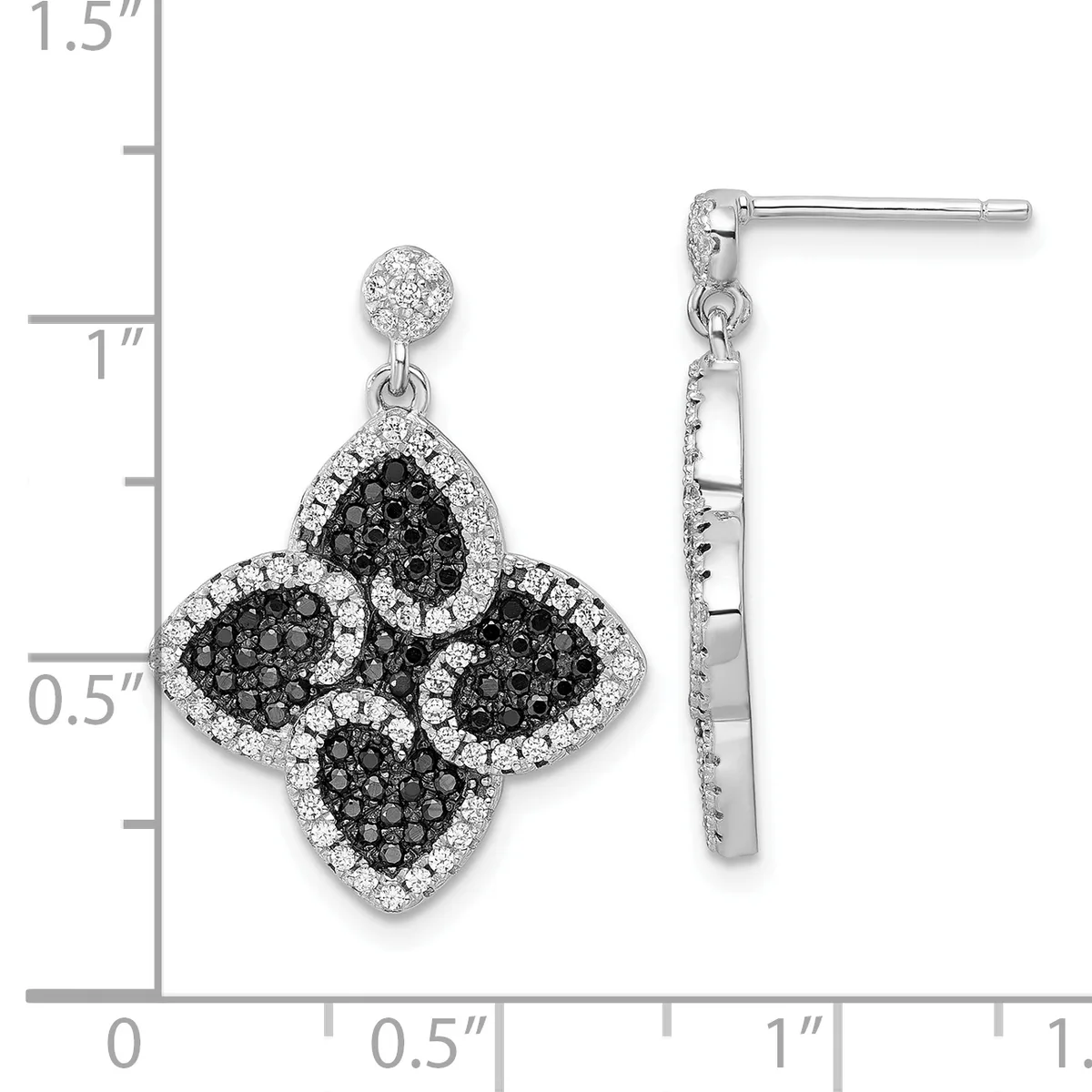 Silver dangle earrings featuring four-lobed clover shapes with black and white pavé crystals, shown against a measurement scale.