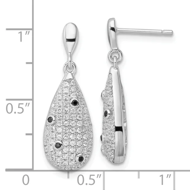 A pair of teardrop-shaped silver dangle earrings with pave cubic zirconia and black onyx accents, shown next to a measurement ruler.