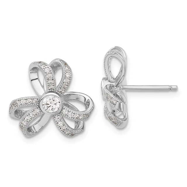 Pair of silver flower-shaped stud earrings with diamond pavé petals and a round diamond center stone, shown from front and side views.