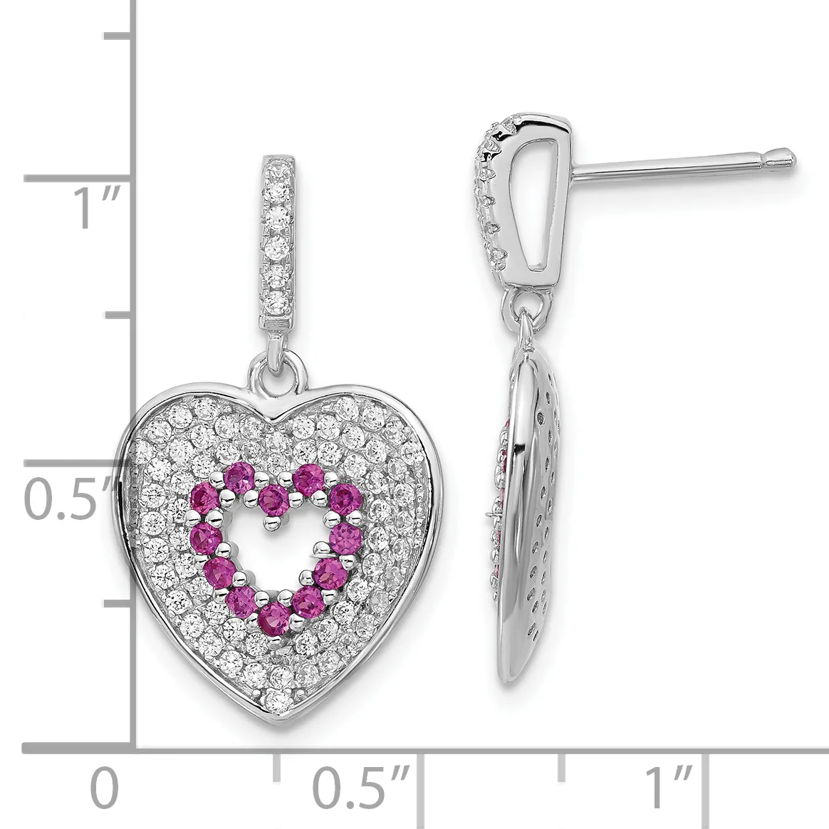 Pair of silver heart-shaped drop earrings with diamond accents surrounding pink gemstones arranged in a heart outline, shown on a measurement scale.