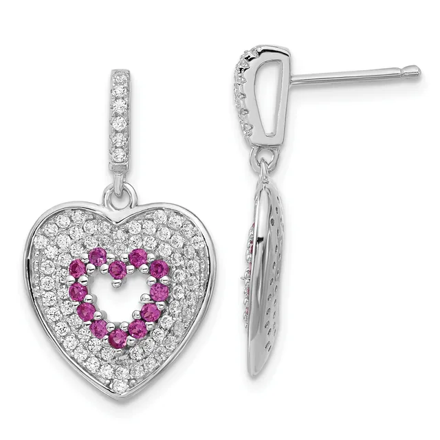 A pair of silver heart-shaped drop earrings with diamond pavé and ruby stones arranged in a heart outline, shown from front and back views.