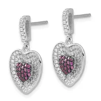Pair of silver heart-shaped drop earrings with diamond pavé surrounds and ruby centers, suspended from diamond-set rectangular posts.