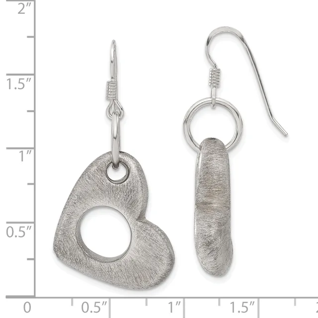 Two pairs of silver earrings displayed against a measurement scale: one pair with textured heart-shaped pendants on post hooks, another with elongated oval pendants on fish hook wires.