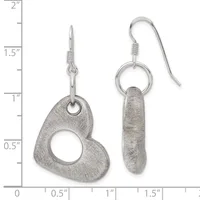 Two pairs of silver earrings displayed against a measurement scale: one pair with textured heart-shaped pendants on post hooks, another with elongated oval pendants on fish hook wires.