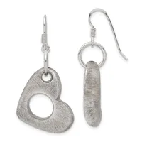 Pair of silver dangle earrings with brushed finish: one heart-shaped with a cutout center, one elongated oval, both suspended from hook wires.