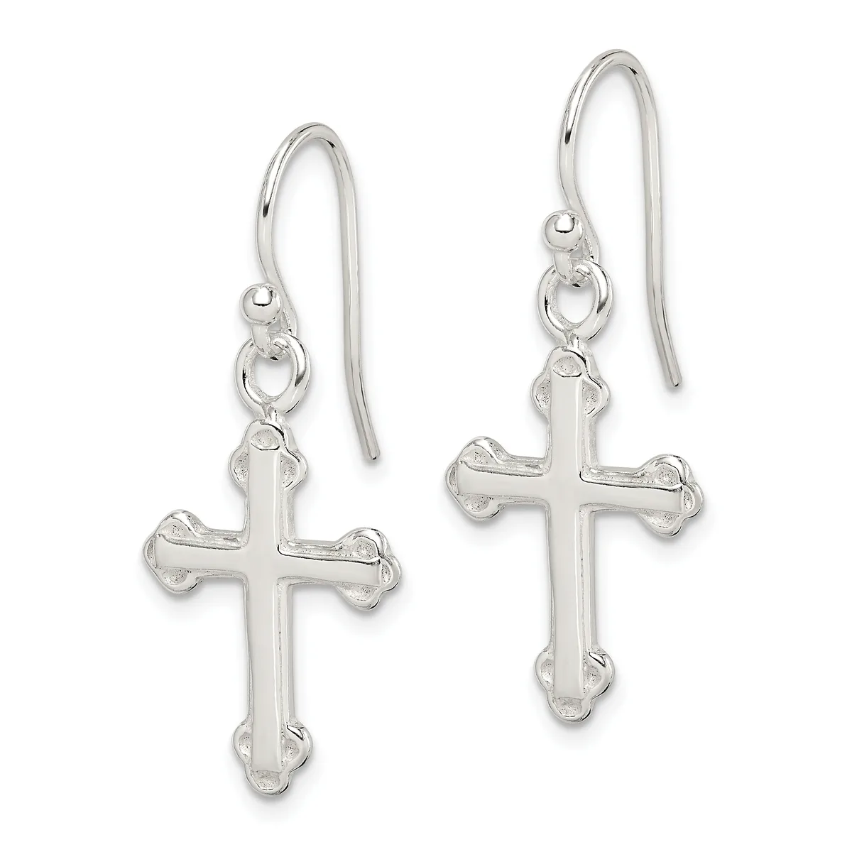A pair of silver cross earrings with decorative edges hanging from curved ear wires.
