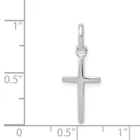 A silver cross pendant shown next to a ruler indicating its size is approximately 0.75 inches wide and 1 inch tall.