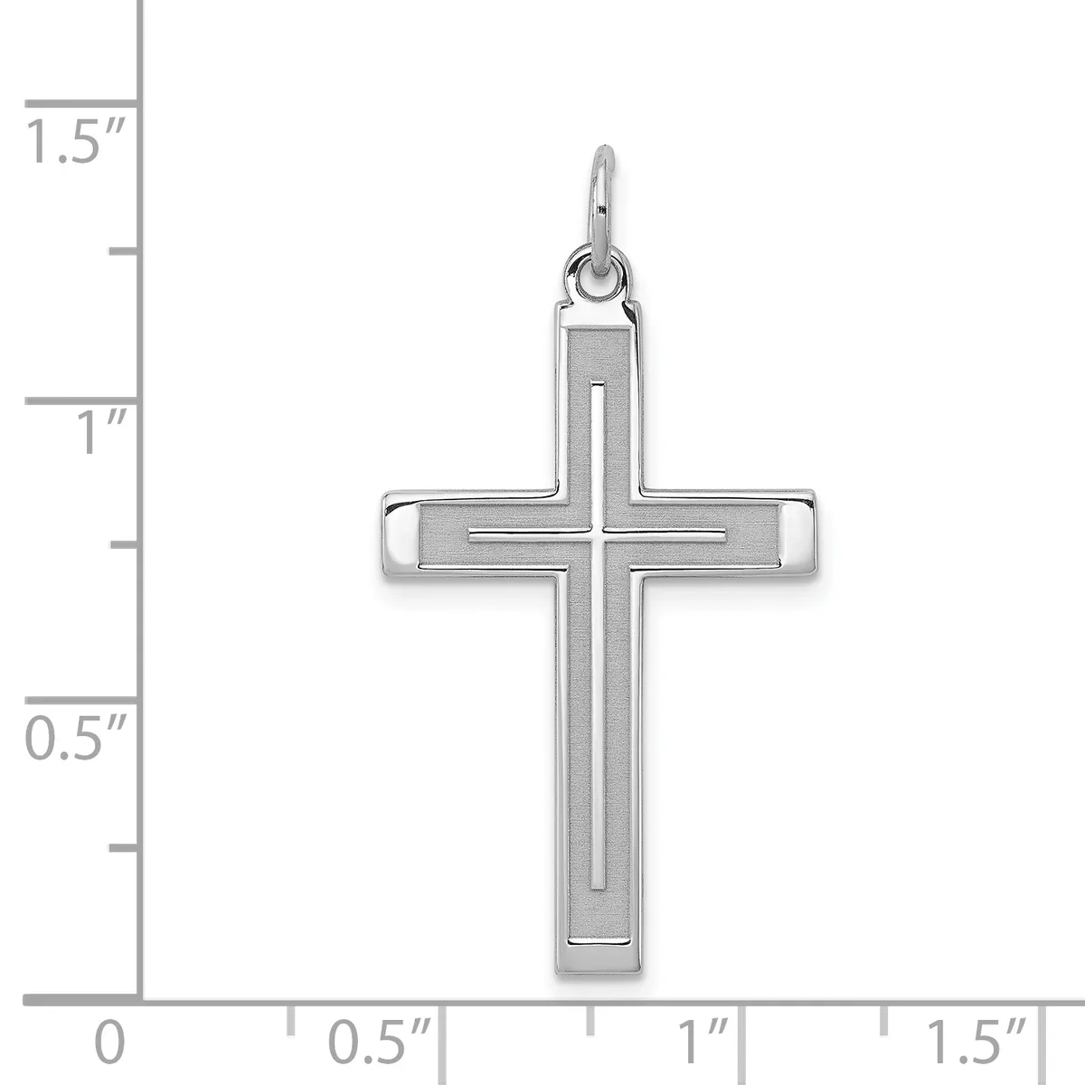 A silver cross pendant with an inner cross design, shown against a ruler measuring approximately one inch wide and one and a quarter inches tall.