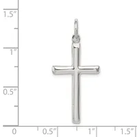 A polished silver cross pendant with a hollow center displayed against a ruler showing it measures approximately one inch wide and one and one-quarter inches tall.