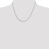 A thin silver chain necklace displayed on a mannequin torso against a white background.