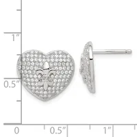 A pair of heart-shaped stud earrings with a fleur-de-lis cutout in the center, covered in pave-set cubic zirconia or diamonds, displayed next to a ruler showing they are approximately 0.5 inches tall.