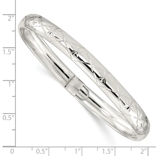 A polished sterling silver bangle bracelet with a diamond-cut pattern, shown next to a ruler indicating it measures approximately 2 inches in height.