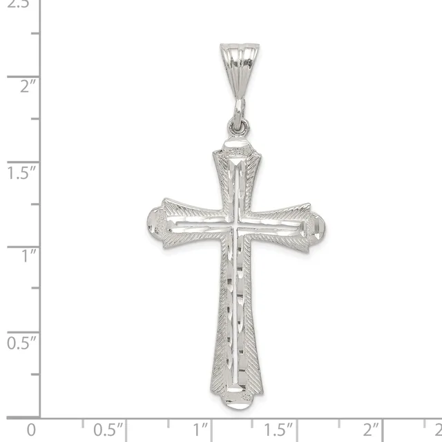 Silver cross pendant with textured surface and hollow ends, shown against a ruler measuring approximately 2 inches in height.