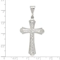 Silver cross pendant with textured surface and hollow ends, shown against a ruler measuring approximately 2 inches in height.