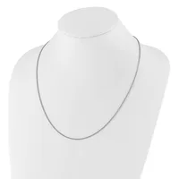 A thin silver chain necklace displayed on a white mannequin bust against a white background.