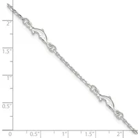 A silver chain bracelet with decorative lobster claw clasps and link details, displayed against a ruler showing approximately 2 inches in length.