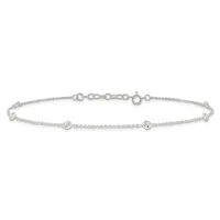 A delicate silver bracelet with a thin chain featuring three round bezel-set cubic zirconia stones evenly spaced along its length, shown against a white background.
