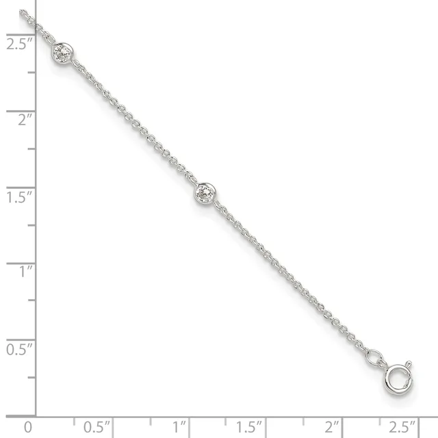Silver chain bracelet with two bezel-set round diamonds spaced along its length, displayed against a measurement ruler.
