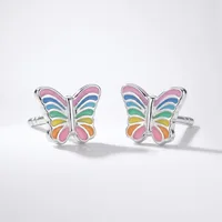 A pair of silver butterfly cufflinks with rainbow-colored enamel wings displayed on a white background.