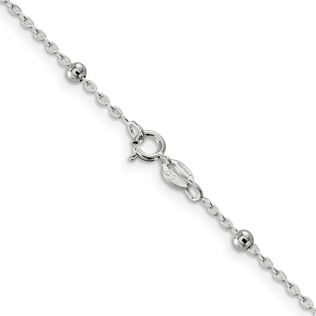A delicate silver chain bracelet with small spherical beads spaced along its length and a spring ring clasp, displayed diagonally against a white background.