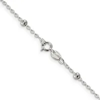 A delicate silver chain bracelet with small spherical beads spaced along its length and a spring ring clasp, displayed diagonally against a white background.