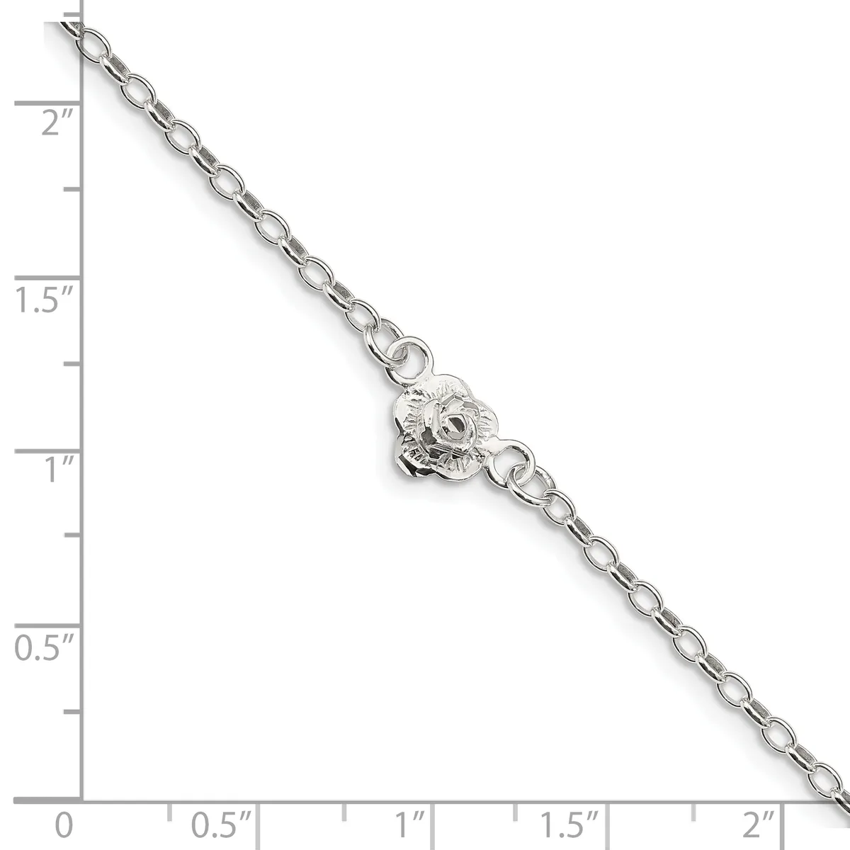 Silver-toned chain bracelet with a decorative lion head charm, displayed against a ruler showing approximately two inches in length.