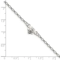 Silver-toned chain bracelet with a decorative lion head charm, displayed against a ruler showing approximately two inches in length.