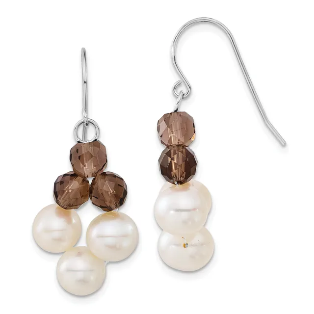 Pair of silver earrings with smoky brown faceted crystal beads on top and three cream-colored pearl beads below, shown on wire and hook closures.
