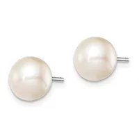 A pair of round white pearl stud earrings with metal posts and backs, displayed against a white background.
