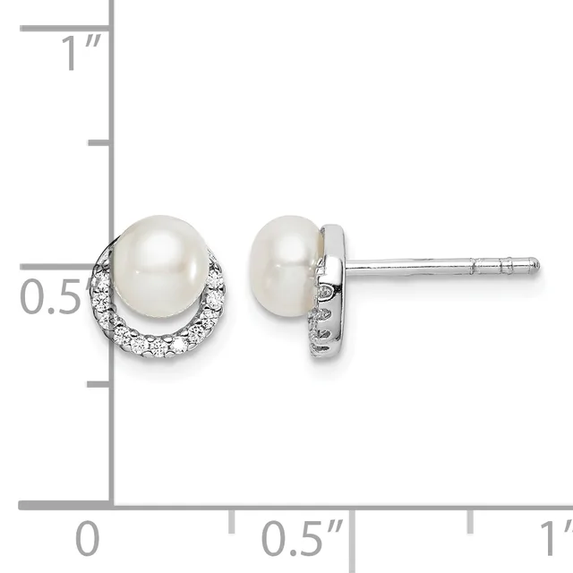 Pair of stud earrings featuring white pearls surrounded by small diamonds in a halo setting, shown against a measurement scale indicating approximately half an inch in height.