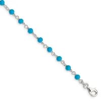 Silver-toned bracelet with turquoise blue round beads connected by ornate silver links, ending with a lobster clasp closure.