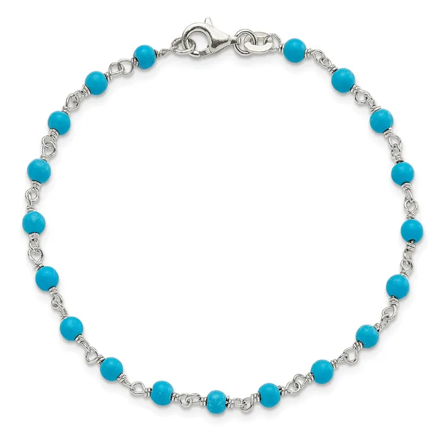 Silver-toned bracelet with alternating turquoise round beads and decorative twisted metal links, finished with a lobster clasp closure.