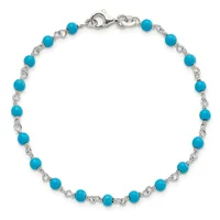 Silver-toned bracelet with alternating turquoise round beads and decorative twisted metal links, finished with a lobster clasp closure.