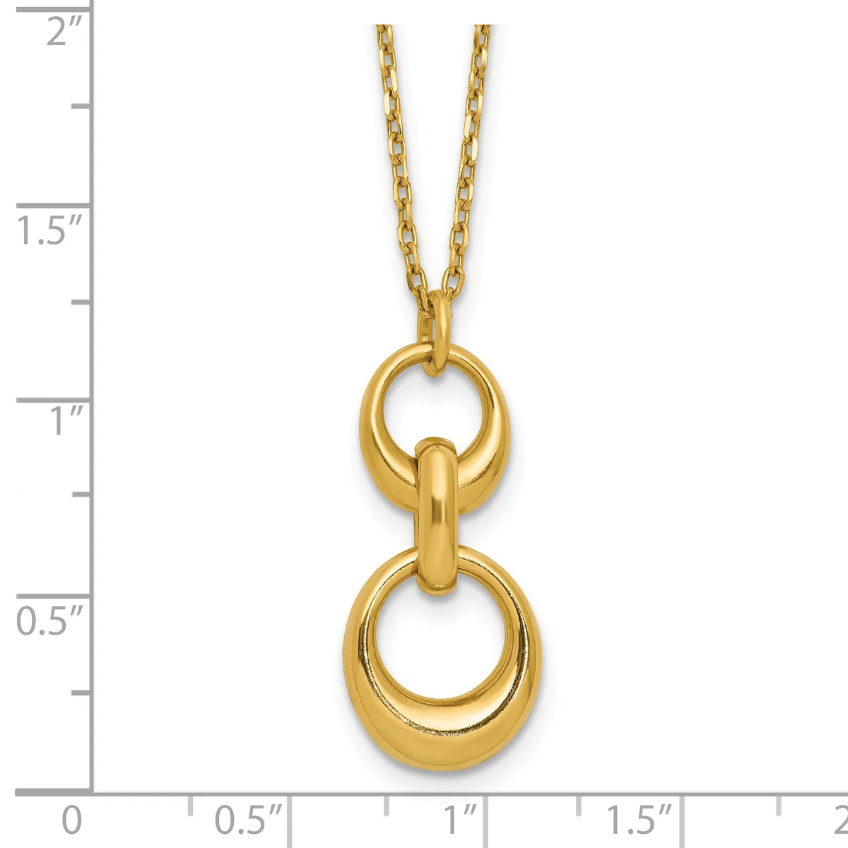 Gold-toned pendant necklace featuring two stacked polished rings connected by a curved bar, displayed on a ruler showing approximately two inches in length.