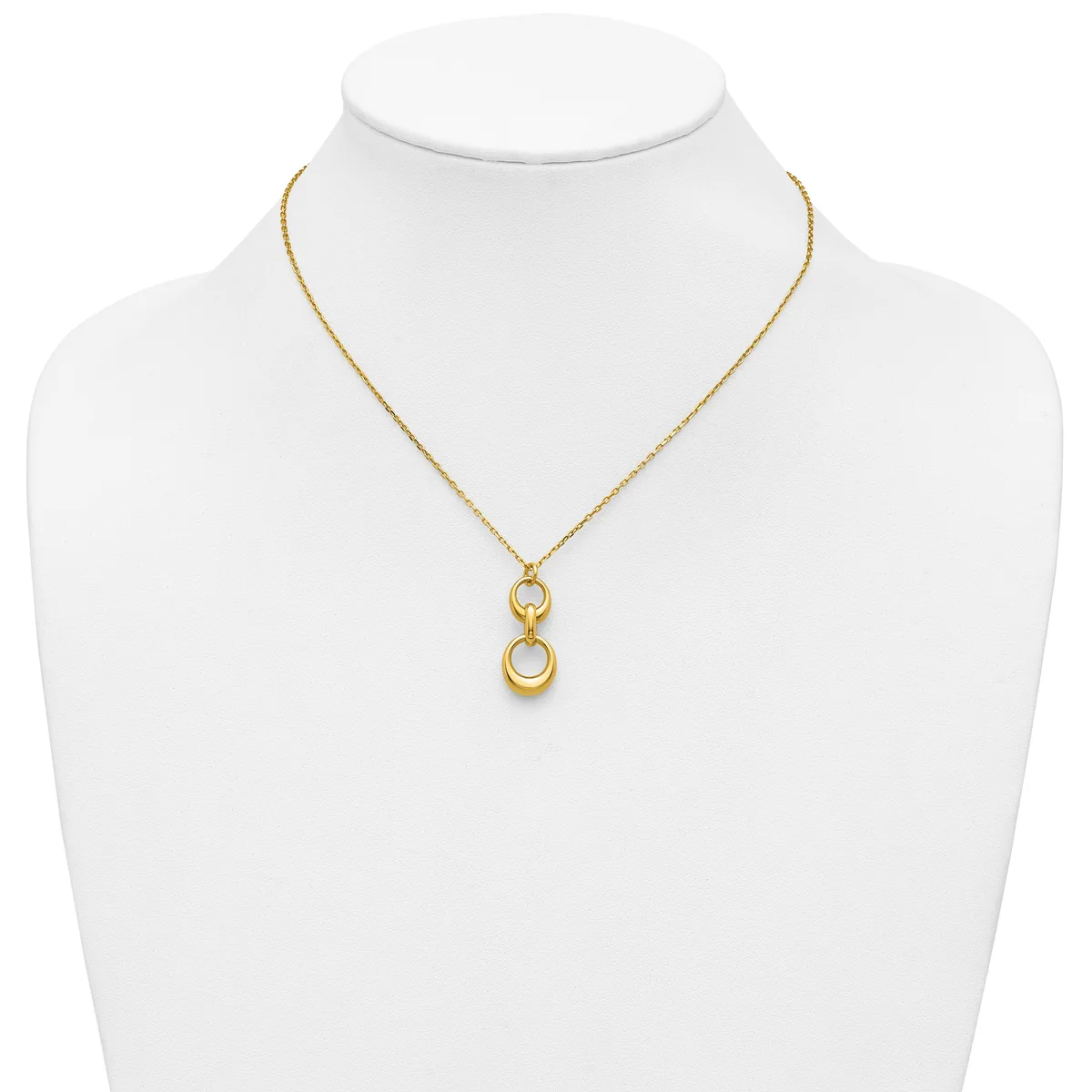 Gold-toned necklace with a delicate chain and a pendant featuring two stacked open circles, displayed on a white mannequin bust.
