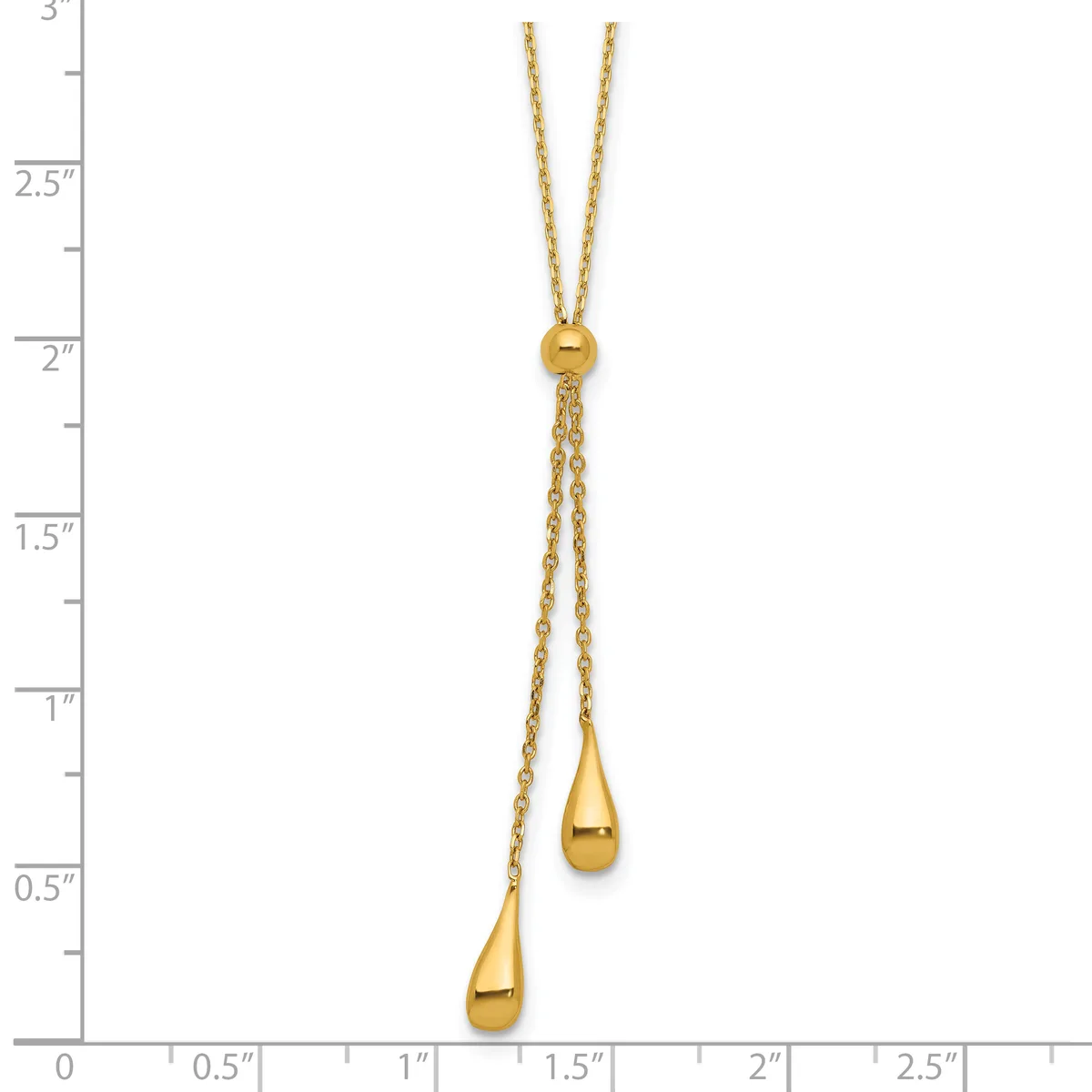 Gold lariat necklace with two teardrop pendants hanging from adjustable chains, displayed against a measurement ruler.