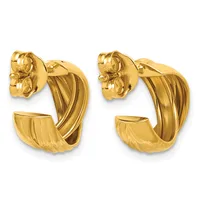 Pair of gold hoop earrings with textured and polished surfaces and decorative floral stud backs, shown from the front.