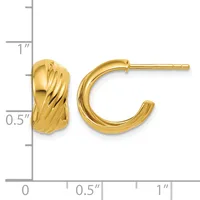 A pair of gold hoop earrings with textured twisted surfaces, displayed next to a measurement ruler showing approximately one inch in length.