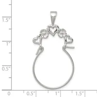 Silver charm holder pendant with heart-shaped top featuring two textured circular elements and small hearts, with an open loop base, shown next to a ruler measuring approximately 1.5 inches tall.