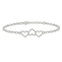 Silver-toned bracelet with a delicate chain link design and three connected heart charms in the center, displayed against a white background.
