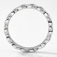 A polished silver ring band with a repeating scalloped or ridged texture around its entire circumference, photographed upright on a white background.