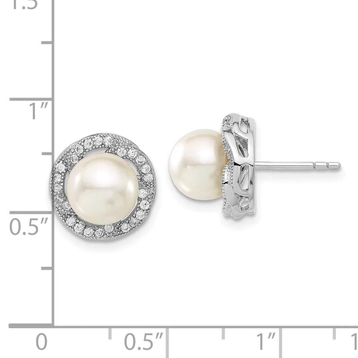Pair of white pearl stud earrings with diamond halos set in white metal, displayed next to a measurement ruler.