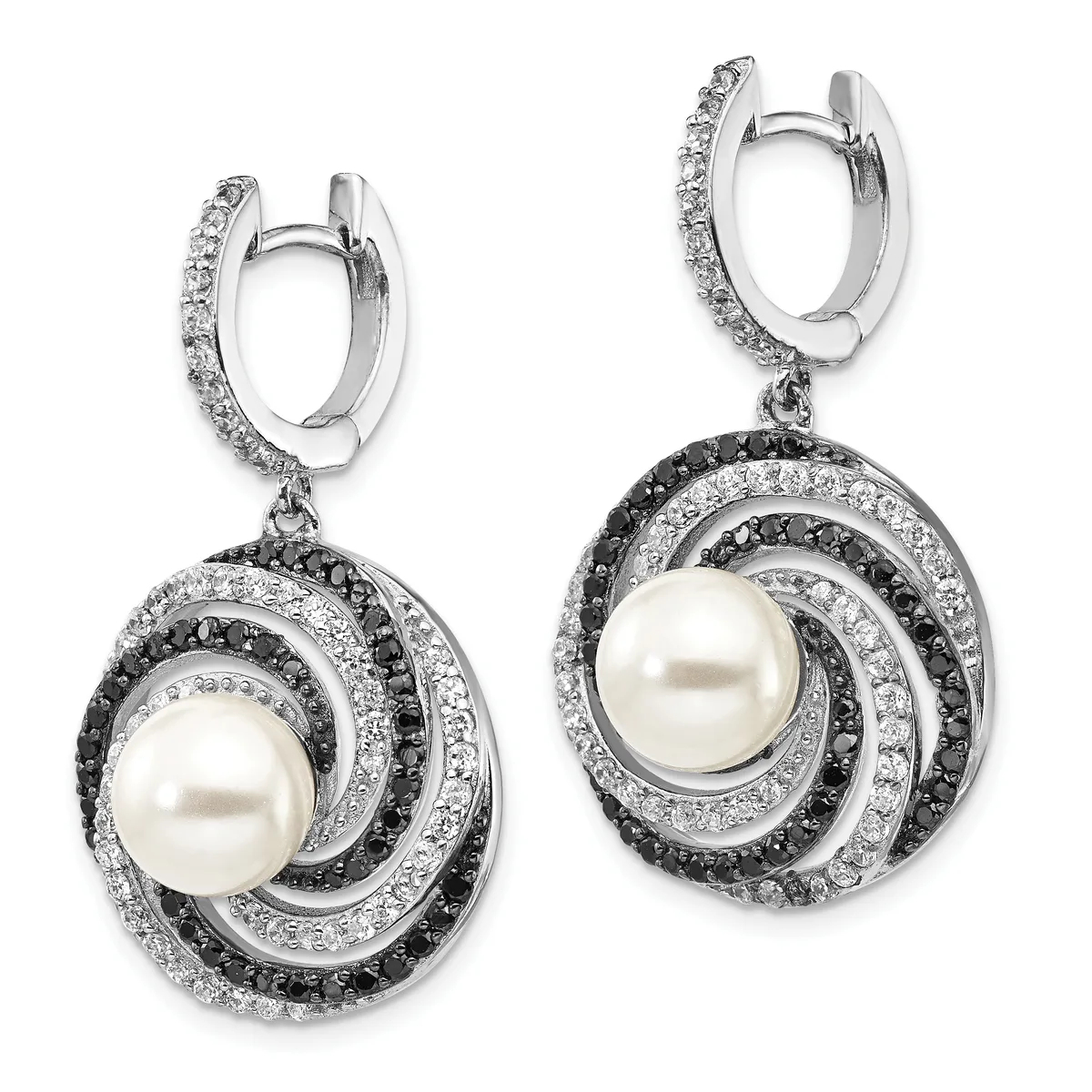 Pair of silver drop earrings with pearl centers surrounded by concentric swirling bands of black and white diamonds, suspended from diamond-set huggie hoops.